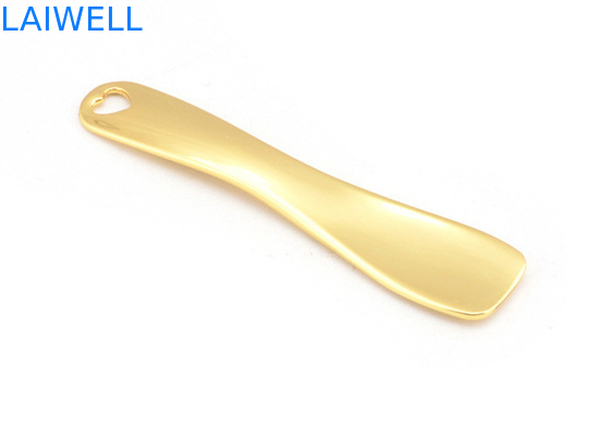 O metal feito sob encomenda morre ouro da carcaça chapeou a colher liga de zinco da composição do creme de cara que carimba gravura a água-forte