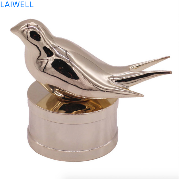 Modernas e modernas tampas de garrafas de perfumes de liga de zinco com design personalizado de pássaro para fragrâncias de alta qualidade